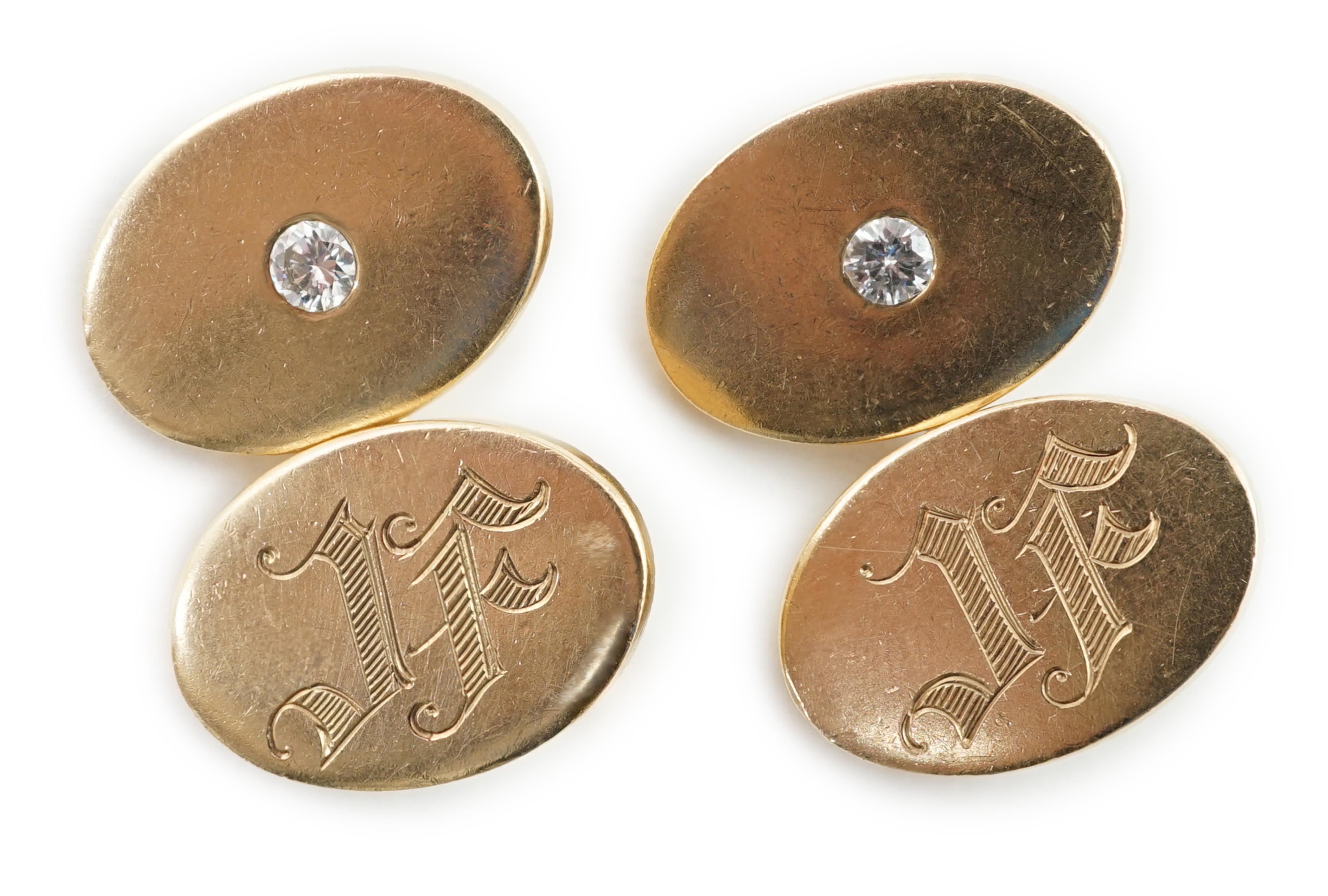 A pair of diamond set 10k gold cufflinks